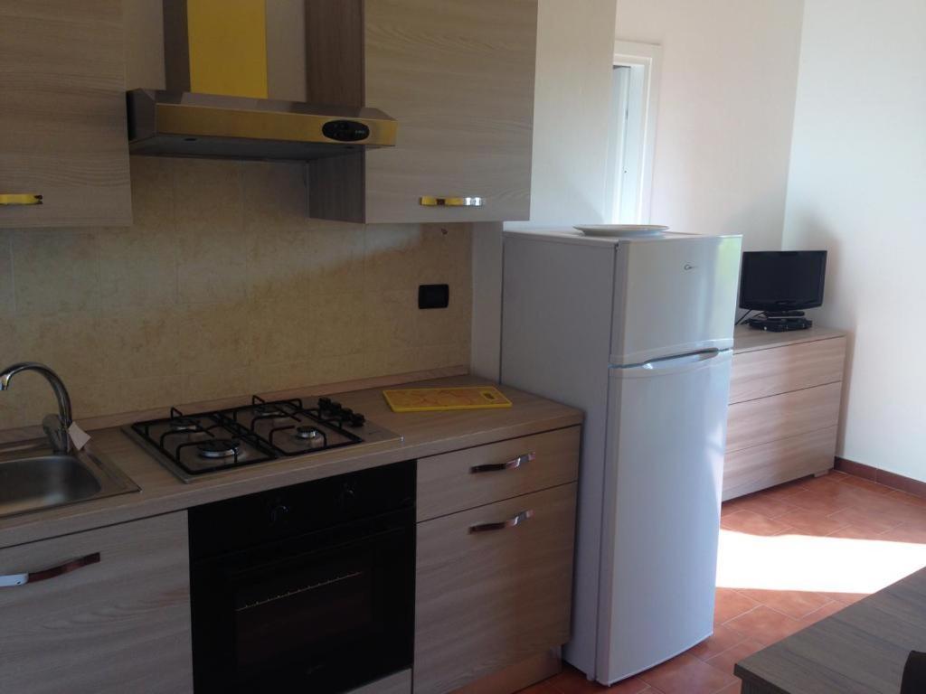 Sardinia Beach Apartments อาเญ็นตู ภายนอก รูปภาพ